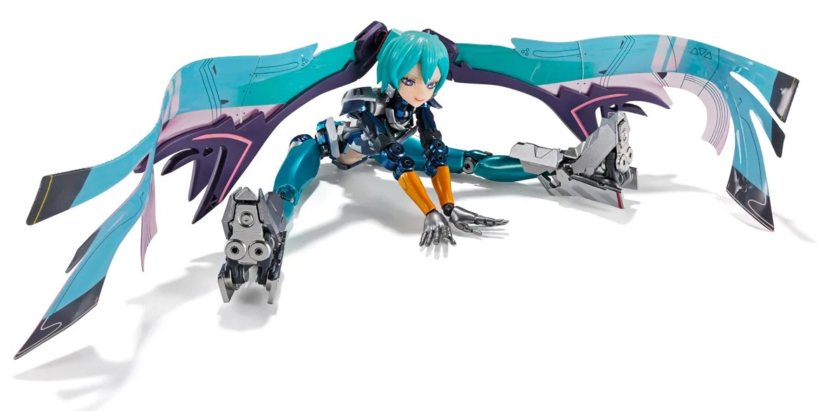 The METAL BUILD Hatsune Miku figure on a white background, crouched low in a splits pose with one hand on the floor, her long teal twin tails spread wide like wings and silver mechanical boots.